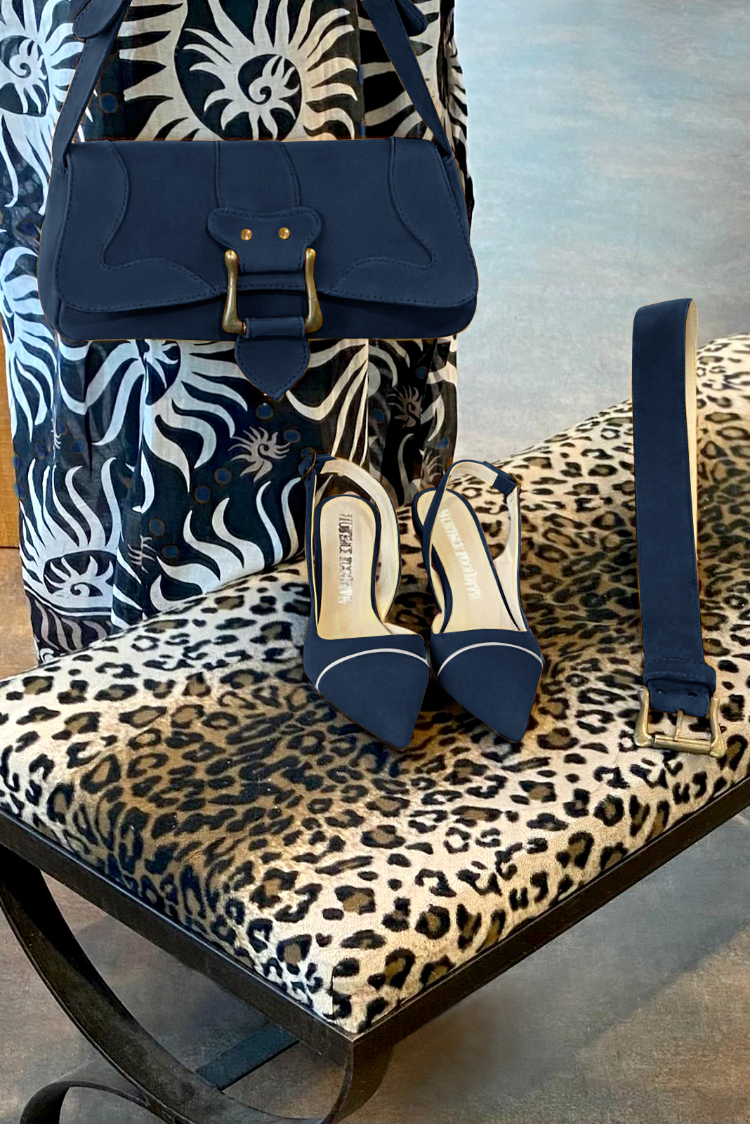 Navy blue and light silver women's slingback shoes. Pointed toe. Medium spool heels. Worn view - Florence KOOIJMAN